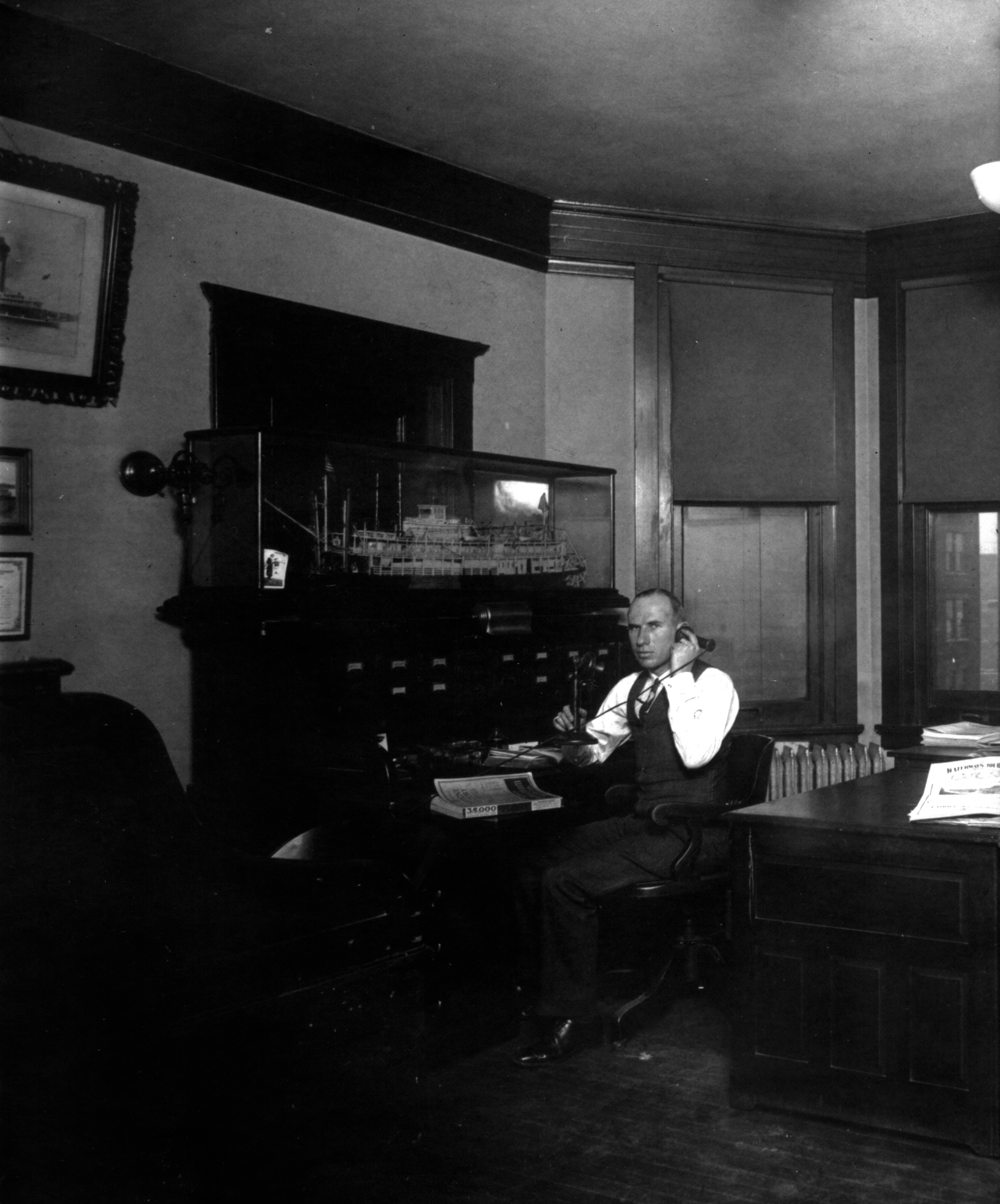 (Image: Capt. Donald T. Wright seated at a desk)