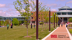 walkway to the MSC with students outside in the grass