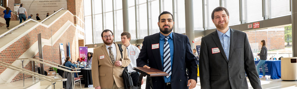 students in suits at the career fair