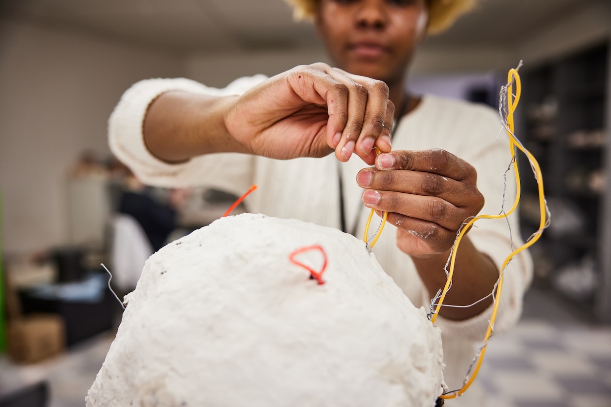 student working on a piece of art