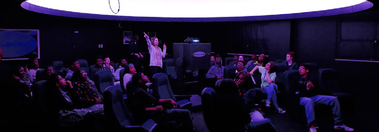 an audience in the planetarium