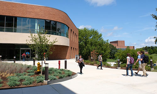 students walking in front of ABH