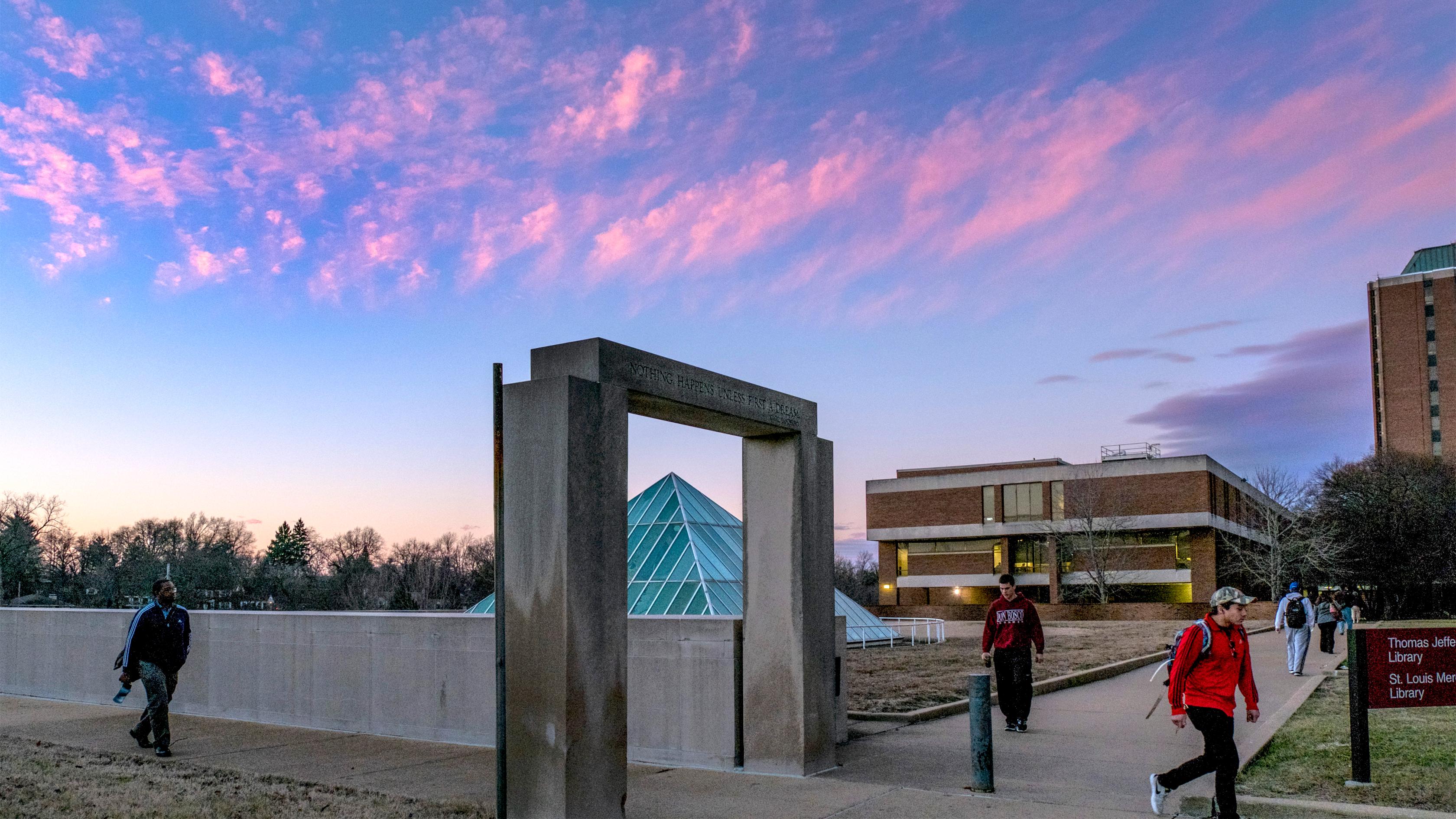 library pyramid with ssb tower in background as students walk by