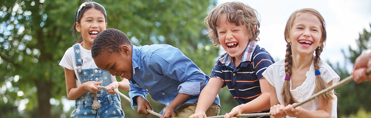 4 children playing tug of war