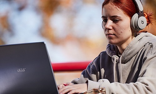 female student at a laptop